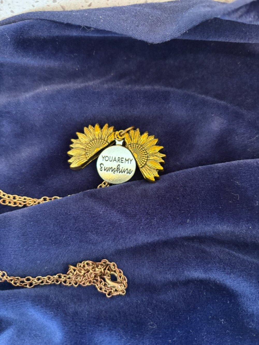 Sunflower pendant, opens with message "You are my Sunshine"
